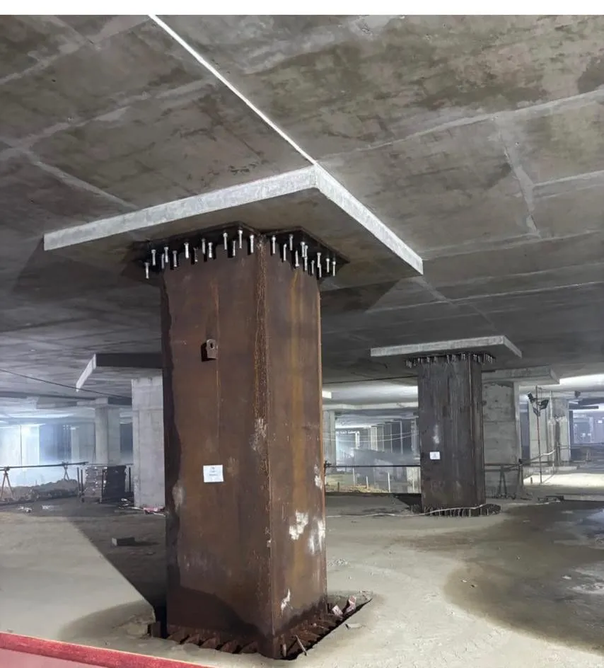 Basement column encased in bolted steel plates